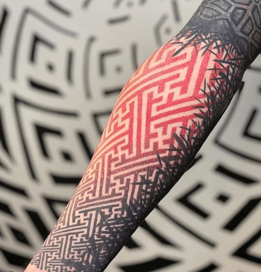 Dotwork tattoo na ręce w kolorze czerwono-czarnym