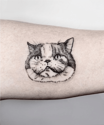 Tatuaż kotu, jako głowa kota